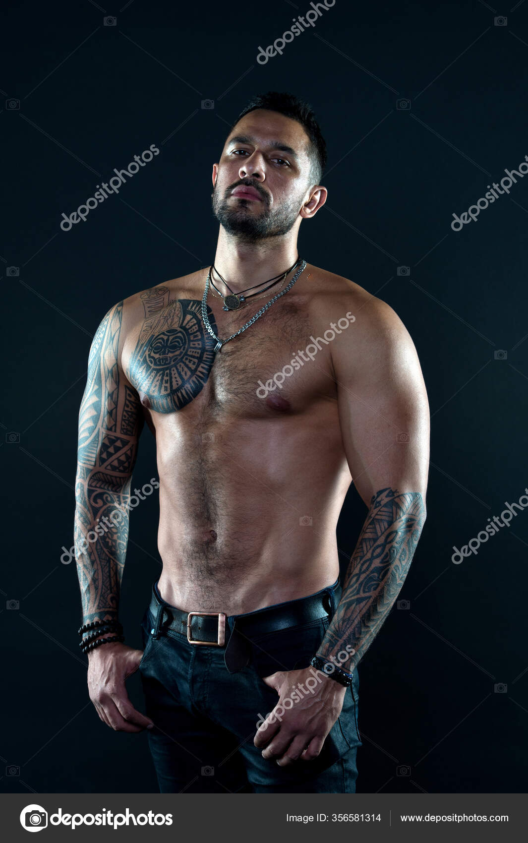 Sport and fitness. Masculinity. Muscular torso. Tempting glance. Bearded man  with tattooed torso. Macho sexy bare torso. Fit model with tattoo art on  skin. Sportsman or athlete with beard and hair Stock