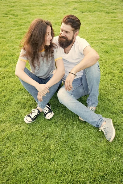 Being in love. perfect date. family weekend. couple in love. valentines day. cute girl and bearded man hipster on green grass. summer relax in park. romantic couple having fun together