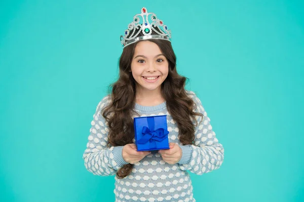 kid in princess crown. happy birthday daughter. Birthday Princess. Kid silver crown symbol of glory. portrait of pride. happy childrens day. cute smiling little girl with gift box