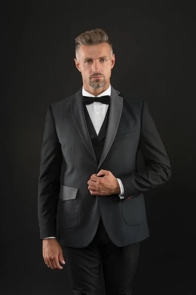 Appreciate classics. Bearded man with formal look. Hipster black background. Brutal man in tuxedo suit. Classic can make man look smarter. Black tie. Fashion shop. Buy clothes. Menswear concept — Stock Photo, Image