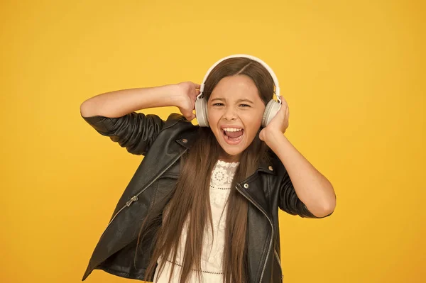 Lady DJ long hair. happy smile. hipster urban style girl. lifestyle concept. biker kid in headset. small girl in leather jacket. autumn fashion style. child listen rock music. little school radio dj — Stock Photo, Image