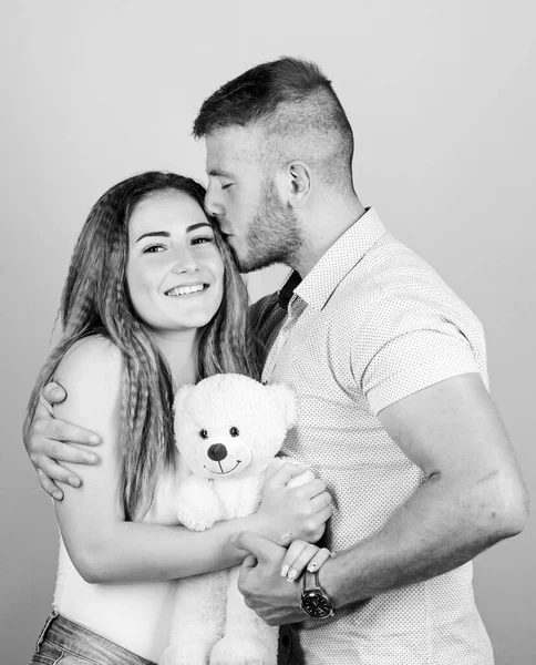 Valentines day holiday. Soft toy teddy bear gift. Man and woman couple in love. Romantic surprise. Man and pretty girl in love. Family love. Guy and girl cuddling. Enjoying each other. Happy family — Stock Photo, Image