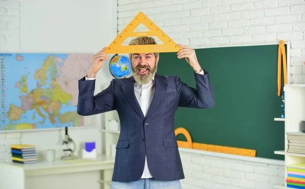 Handsome bearded man in classroom chalkboard. Modern teaching method. Just in theory. Communicative skills. Good luck. Modern teacher lesson. Study and education. Modern school. Knowledge day