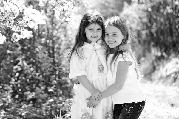 Children pose together on nature background, defocused. — Stock Photo, Image