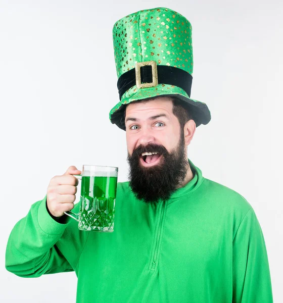 Cheers concept. Colored patricks beverage. Green color part of celebration. Irish beer pub. Celebration irish culture. Man bearded hipster hat patricks day drink pint beer. Saint patricks day holiday — Stock Photo, Image