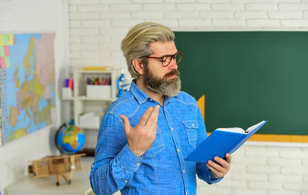 Aristocrat scholar. back to school. literature and language learning. strict teacher in glasses. teacher check knowledge. are you ready for exam test. man tutor in classroom. use notebook or book — Stock Photo, Image