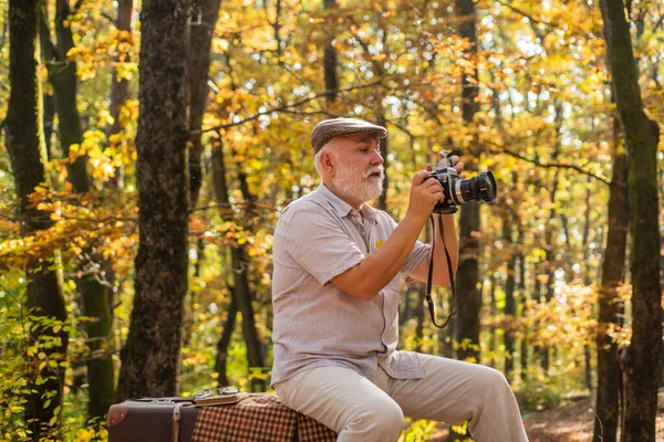 stock image Every man has his hobby. Elderly man look at camera in autumn nature. Doing photography as hobby. Landscape and nature photography. Hobby and lifestyle. Hobby he really enjoys