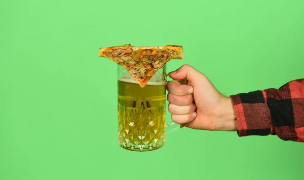 Take it. Male hand hold glass of beer and slice of pizza on. Perfect rest in pub. Eat pizza and drink beer. Finally pizza time. Pizza is better when shared. Pizzeria restaurant. Takeaway option