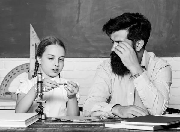 Work together to accomplish more. Explaining science to child. Fascinating lesson. School teacher and schoolgirl. Man bearded teacher excellent pedagogue. Pedagogue skills. Talented pedagogue — Stock Photo, Image