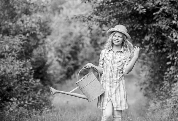 My job is my passion. spring country side village. summer season. small girl with watering can. earth day. environment ecology. nature protection. girl farmer care plants. farming and agriculture — Stock Photo, Image