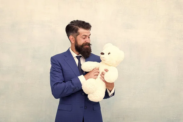 Fabulous gift for little ones. Bearded man hold teddy bear. Businessman with toy gift blue background. Happy boxing day. Cuddly soft present. Gift shop or store. Shopping for gift, copy space — Stock Photo, Image