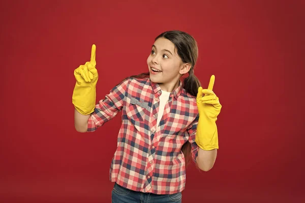 Inspiring changes. Spring cleaning. House cleaning service. Cleaning supplies. Small girl rubber gloves for cleaning red background. Appreciate cleanliness. Clean house. Housekeeping duties — Stock Photo, Image