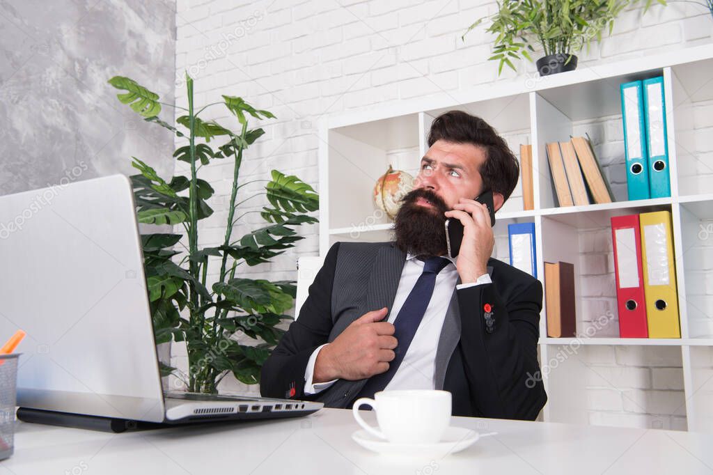 Mobile phone communication. Bearded man talk on phone in office. Businessman establish communication with customers. Business communication. Communication system. 3G. 4G. New technology