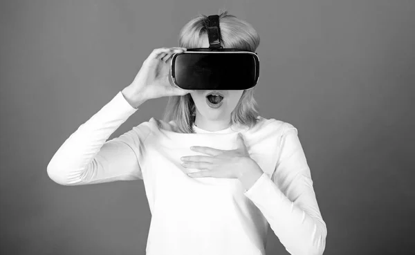 Woman using VR device. Woman enjoying cyber fun experience in vr. Portrait of young woman wearing VR goggles, experiencing virtual reality using 3d headset. Immersive icons. — 스톡 사진