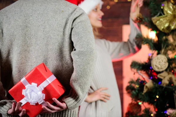 Giving and sharing. Surprise effect. Generosity and kindness. Prepare surprise. Winter surprise. Man carry gift box behind back defocused background. Christmas surprise concept. Surprising his wife