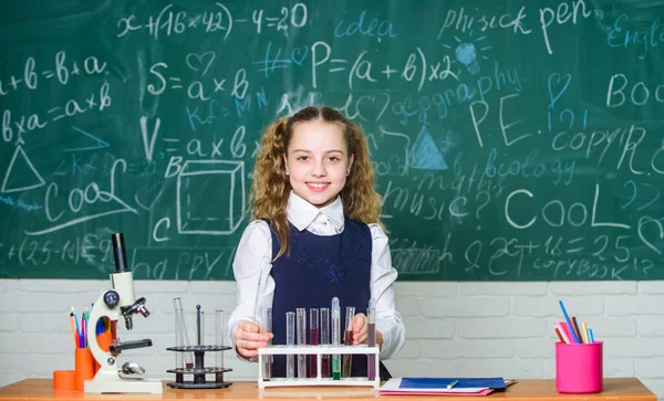 Student doing biology experiments with microscope. Little child at school lesson. Chemistry. Back to school. childrens day. Little girl learning chemistry in school lab. She need an expert advice — Stock Photo, Image