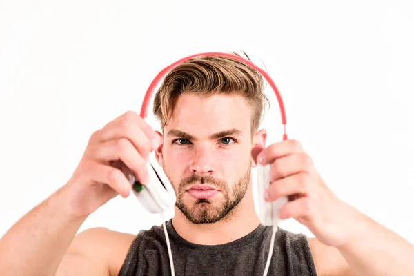 Audio training for motivation. Listen music. Professional software and devices. Entertainment concept. Man handsome guy hold headphones. Music taste. Check out music album. Music as daily therapy