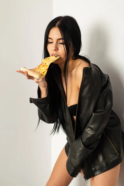 Sensual woman enjoy eating pizza. Eating and diet. Pizzeria takeaway. Good to the last slice. Mediteranean cuisine. Pizza menu. Hot and ready. Delight to eat. Sexy woman eat pizza. Unhealthy eating