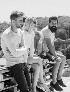 Having fun. best friends. Summer vacation. diverse young people talking together. group of four people. The great fit for the day off. Group of people in casual wear. cheerful men and girl relax