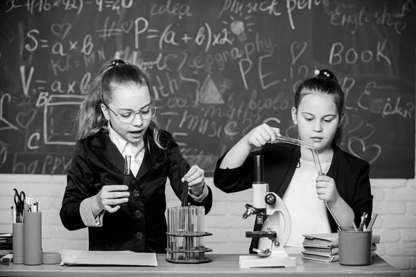 For a better tomorrow. Little girls genius in school lab. Science lab. science experiments in laboratory. Biology lab. Genius. Little girls scientist with microscope. Chemistry research in laboratory