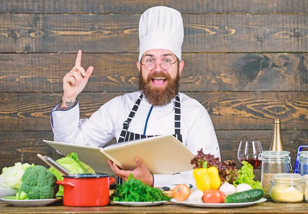 Cooking with passion. Healthy food cooking. Mature hipster with beard. Cuisine culinary. Vitamin. Happy bearded man. chef recipe. Dieting organic food. Vegetarian salad with fresh vegetables