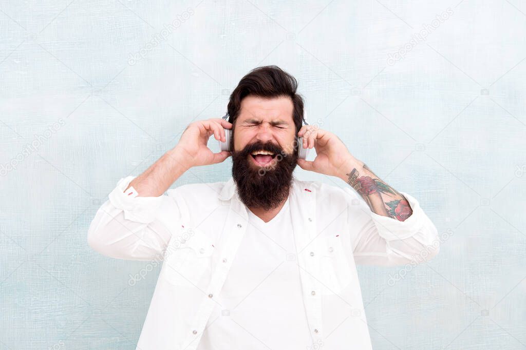 Hipster listen music stereo headphones. Modern wireless headphones. Electronic dance music tracks. Instrumental music. Bearded man headphones. Enjoy every note. Active Noise Cancellation Technology