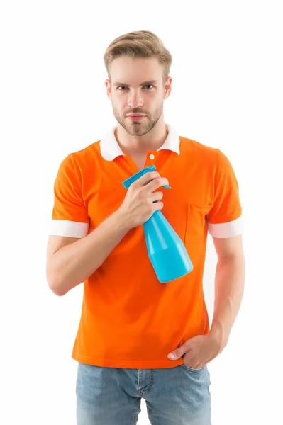 Keep your house dust-free. Handsome man hold hygiene spray bottle. Disinfectants and antibacterials in home hygiene. Household cleaning. Cleanliness and hygiene. Stop microbes use good hygiene