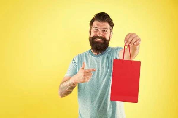 Try this. Man with purchase. Buy product. bearded man go shopping. Shop store mall boutique. mature male cheerful with fashion purchase. small present. Happy hipster hold paper bag. copy space — Stock Photo, Image