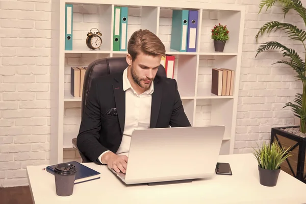 Office man. Handsome man work on computer. Caucasian man in formal style. Office worker or employee. Business man or businessman at workplace. When person and technology become one