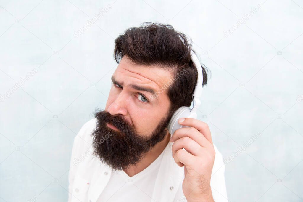 Instrumental music. Bearded man headphones. Enjoy every note. Active Noise Cancellation Technology. Hipster listen music stereo headphones. Modern wireless headphones. Electronic dance music tracks