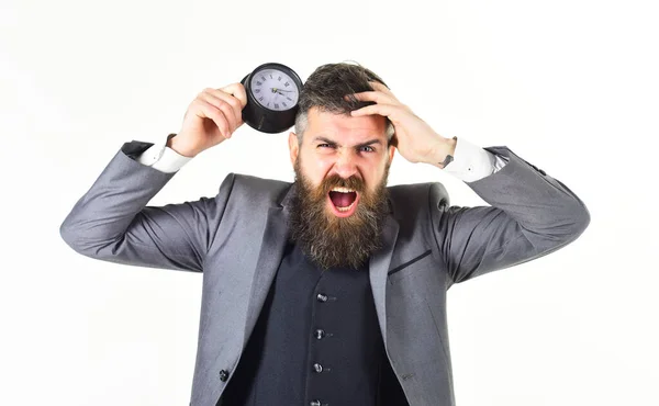 Überlasteter Geschäftsmann hält über Zeitschaltuhr — Stockfoto