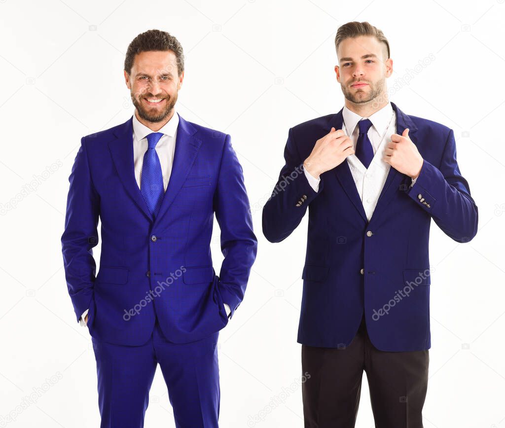 Man with beard and smiling face near serious business partner.