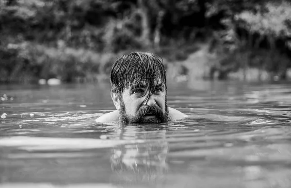 furry monster. wild man. time to relax. bearded man swimming in lake. summer vacation. mature swimmer. brutal hipster with wet beard. refreshing in river water. water beast. What a great day