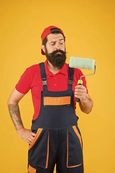 Painters work. Construction and renovation services. Decoration and decor. Perfect surface painting. Skillful painter. Bearded man painter on yellow background. Painting tool. Brush roller painter — Stock Photo, Image