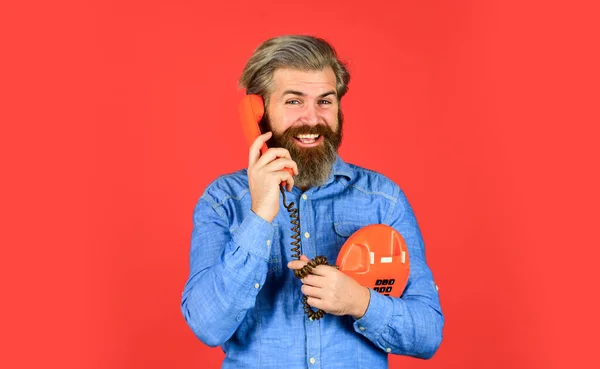 Build an audience. buy new gadget. phone business concept. Businessman touts retro phone. Retro customer service. communication. Man talking to vintage phone. businessman talking on vintage phone