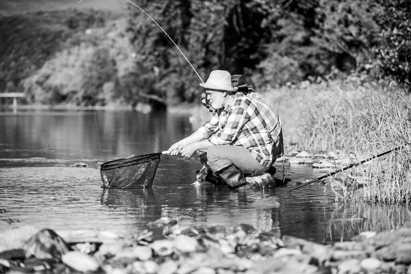 Peaceful fishing. Two male friends fishing together. happy fishermen friendship. fly fish hobby of men in checkered shirt. retirement fishery. Catching and fishing. retired dad and mature bearded son — Stock Photo, Image