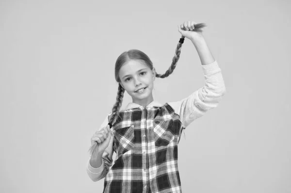 Happy school girl casual style. kid fashion. child cute blond hair. childhood happiness. happy childrens day. small girl checkered jacket. autumn time. hipster girl yellow background. Courage to act — Stock Photo, Image