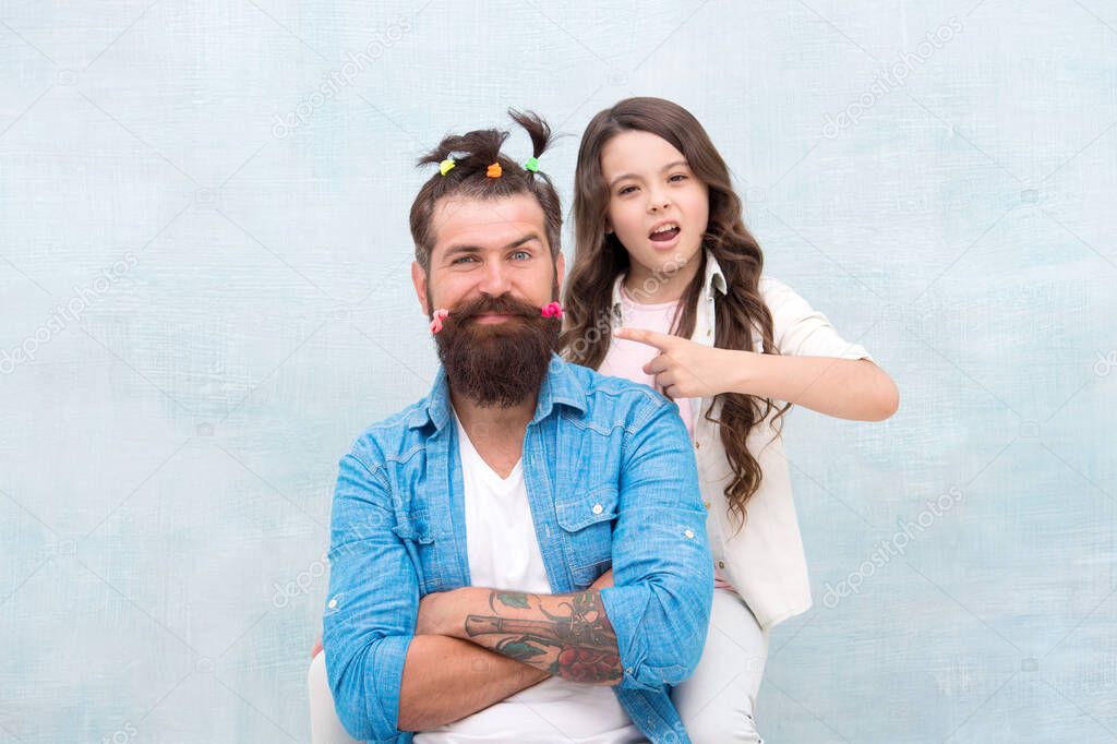 Making me happy. Daughter creating fathers hair. Handsome father with little girl. Happy father and daughter. little girl love her daddy. happy fathers day. family. Fathers day with daughter at home