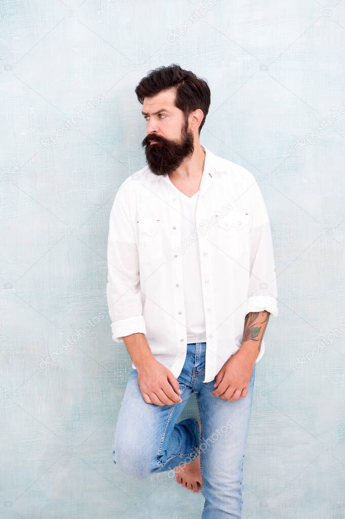 Fashion clothes. Attractive guy wall background. Summer fashion. Bearded model casual outfit. Fashion model. Mature handsome hipster with beard wear white shirt. Summer collection. Menswear concept
