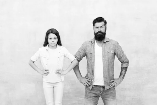 Want to be like my father. Being hero for daughter. Strong temper and confidence. Little child and hipster father on white background. We are team. Bearded father and small girl stand hands on hips — Stock Photo, Image