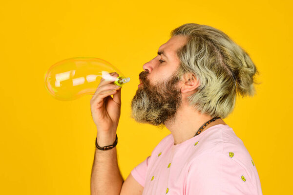 Good vibes. Blow inflate bubbles. Forever young guy. Positive. Carefree man soap bubbles. Summer vacation. Infantility concept. Happy playful bearded hipster and soap bubbles. Happiness and joy