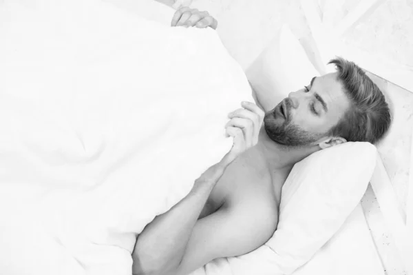 Man looking under blanket. Morning wood formally known nocturnal penile tumescence common occurrence. Male reproductive system. Why men get morning erections. Normal erections occur. Guy relax in bed — Stock Photo, Image