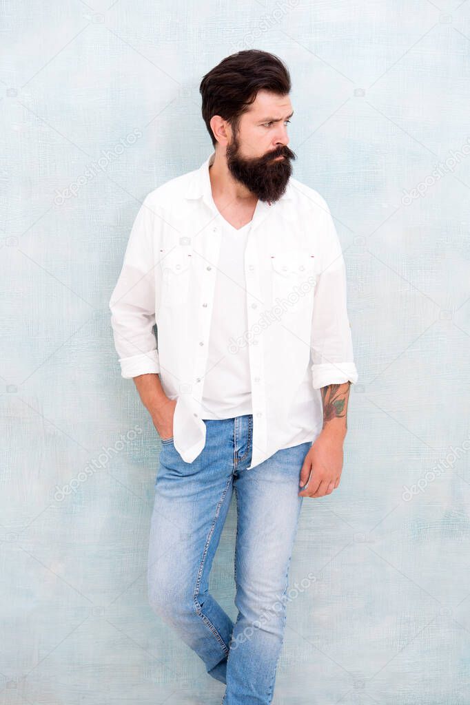 Summer collection. Menswear concept. Fashion clothes. Attractive guy wall background. Summer fashion. Bearded model casual outfit. Fashion model. Mature handsome hipster with beard wear white shirt