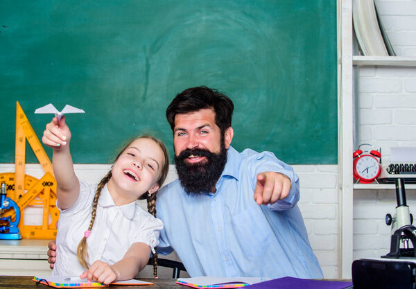 Developing caring learners who are actively growing and achieving. School learners leisure. Creating a community of learners. Teacher and schoolgirl. Man bearded pedagogue and pupil having fun