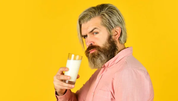 Milk for good health. Lactose free. Bearded man hold glass of milk. Vegan milk concept. Drink protein cocktail. Healthy habits. Almond milk is rich in several healthy nutrients. Source of calcium