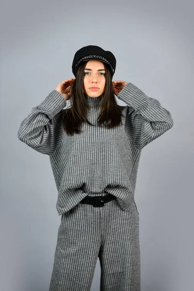 Shop Your Style. Designed for your comfort. Warm comfortable clothes. Casual style for every day. Fashionable knitwear. Knitwear concept. Feel comfortable. Woman wear grey suit blouse and pants