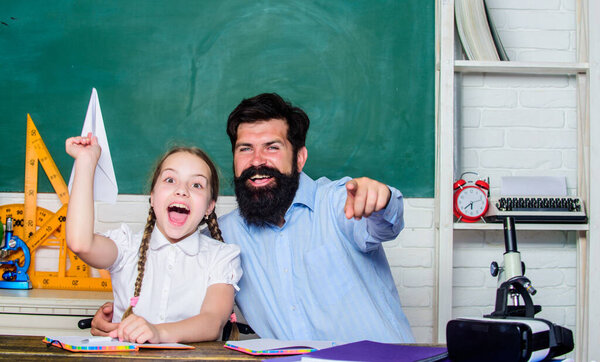 real happiness. knowledge day. Home schooling. small girl child with bearded teacher man in classroom. private lesson. back to school. Private teaching. daughter study with father. Teachers day