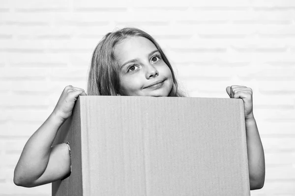 Make moving easier. Girl small child carry cardboard box. Move out concept. Delivering your purchase. Kid moving out. Moving routine. Packaging things. Prepare for moving. Rent house. Real estate — Stock Photo, Image