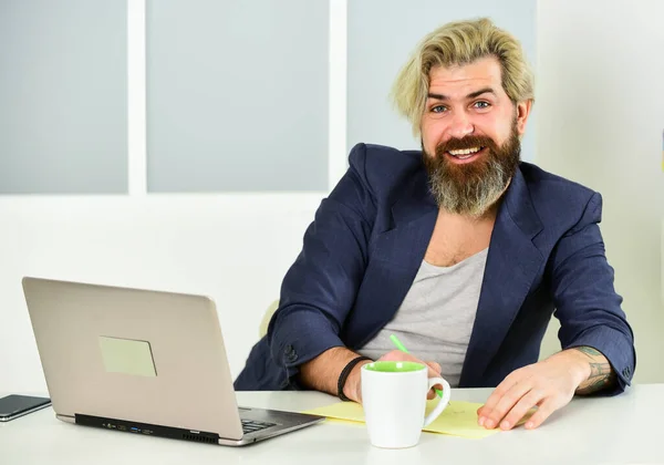 Glad to see you in team. Working Freelance. Workplace with laptop on table at home. lazy sedentary lifestyle. male working from home office. man typing on computer. man at workplace use technology