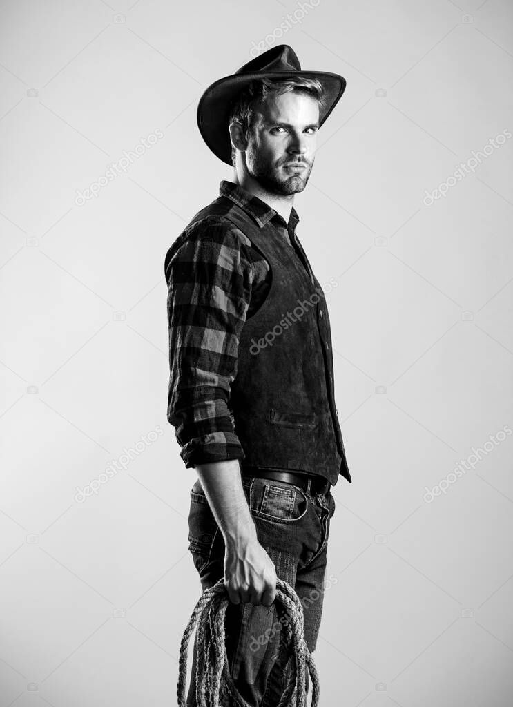 western america. cowboy with lasso rope. Western. Vintage style man. Wild West retro cowboy. man checkered shirt on ranch. western cowboy portrait. wild west rodeo. man in hat
